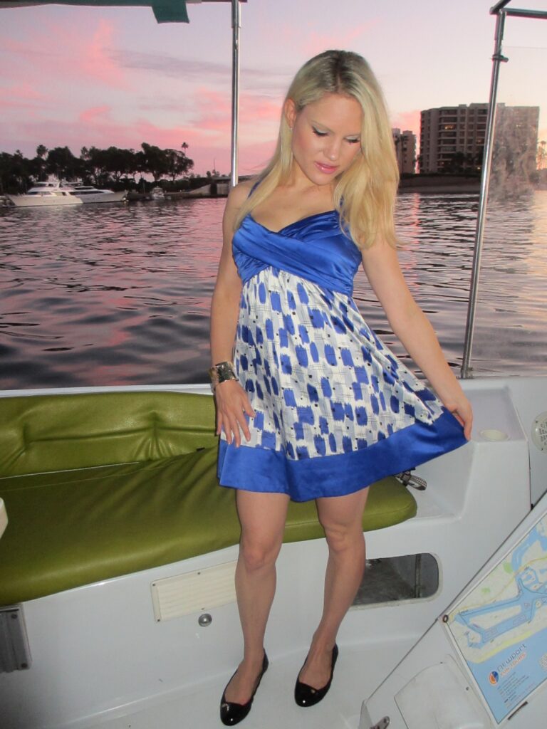 summer dresses, girl in blue print dress on a boat