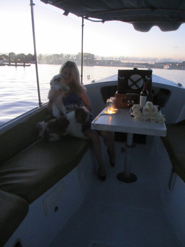 candles in mason jars on a duffy boat, picnic on a boat