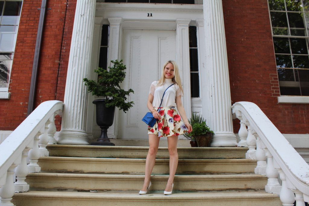 girl in floral skirt on the steps of a brownstone Caitlin Hartley of Styled American
