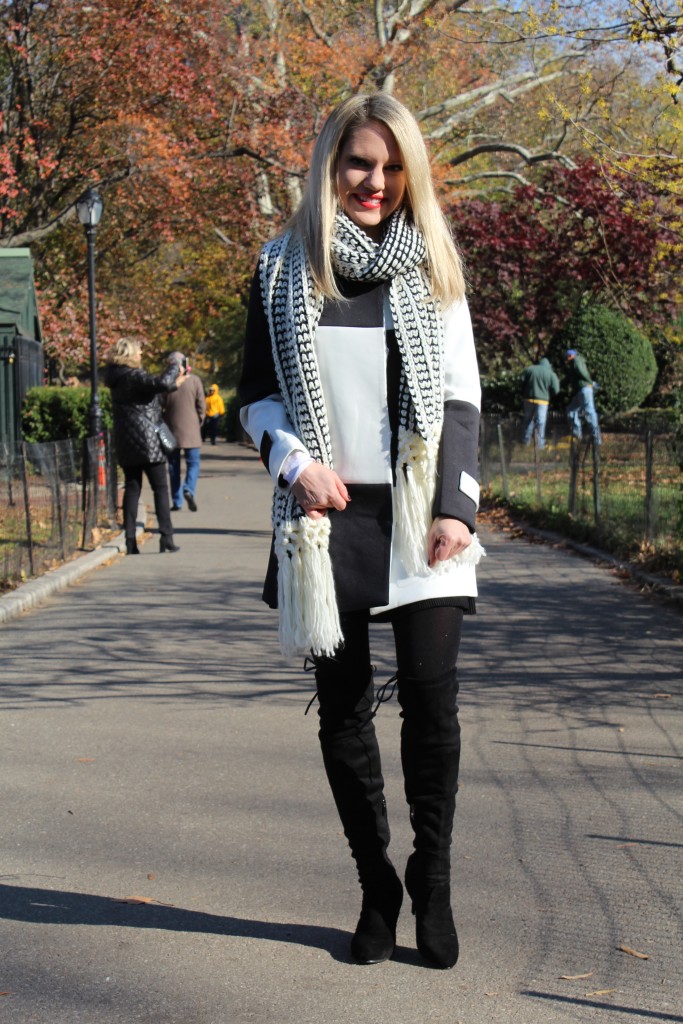 Caitlin Hartley of Styled American black and white coat, cozy scarf, tights and black over the knee boots