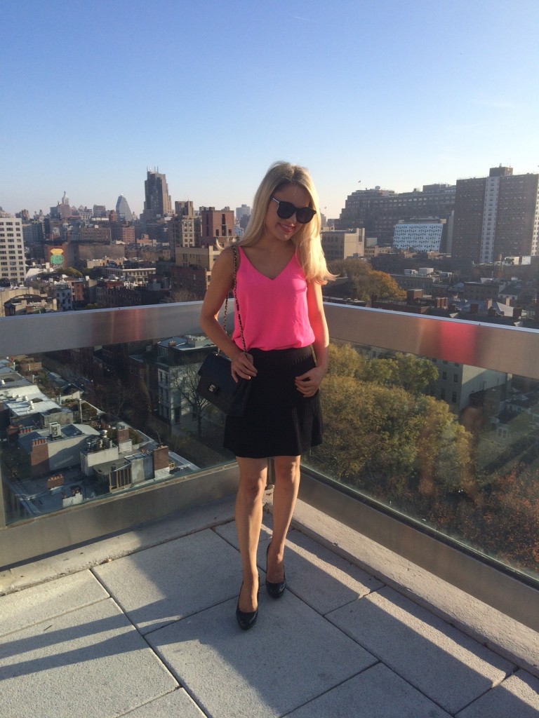 Caitlin Hartley of Styled American hot pink tank top and black chanel bag