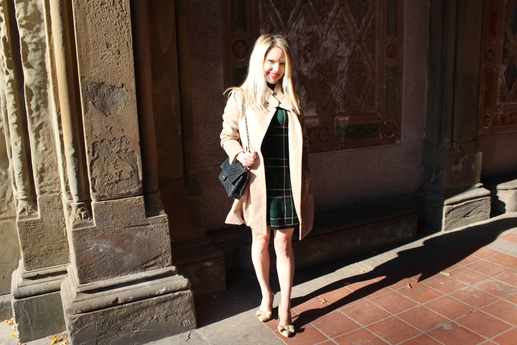 Caitlin Hartley of Styled American green plaid dress and tan coat, bow nude pumps