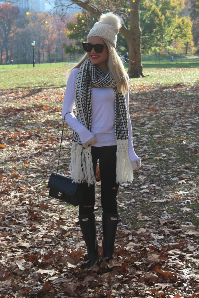 Caitlin Hartley of Styled American girl in ivory beanie in Central Park