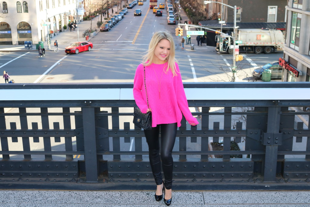 Caitlin Hartley of Styled American view from the highline, bright pink sweater and black leggings