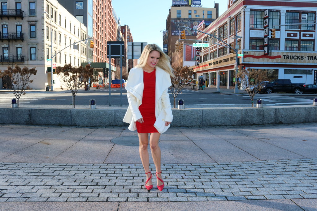 Caitlin Hartley of Styled American red long sleeve tight dress, red pumps and white clutch
