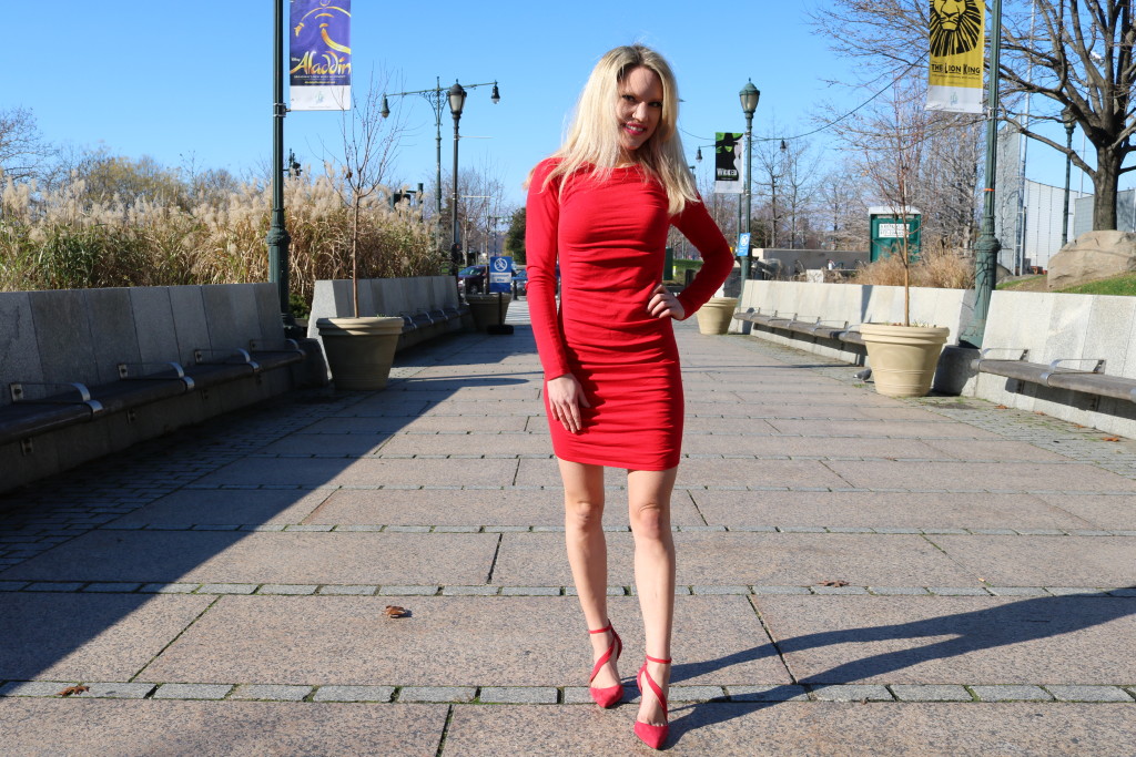 Caitlin Hartley of Styled American fitted short red dress and strappy red heels