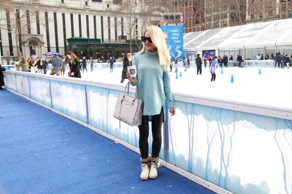 Caitlin Hartley of Styled American bryant park ice skating ring, girl holding coffee in front of rink