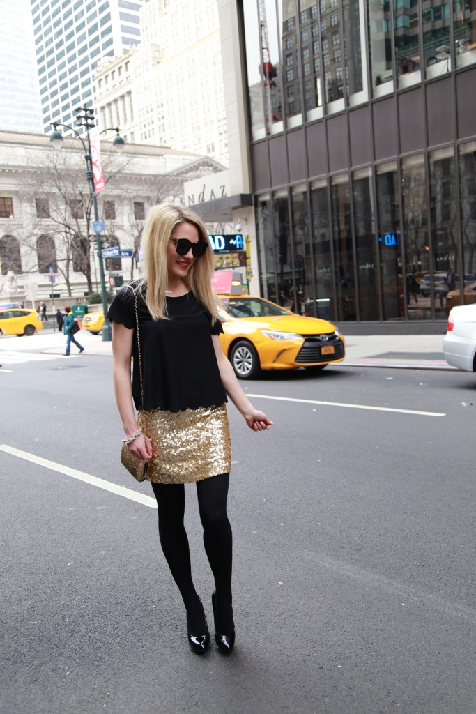 Caitlin Hartley of Styled American sequin skirt, bauble bar links bracelet, black top