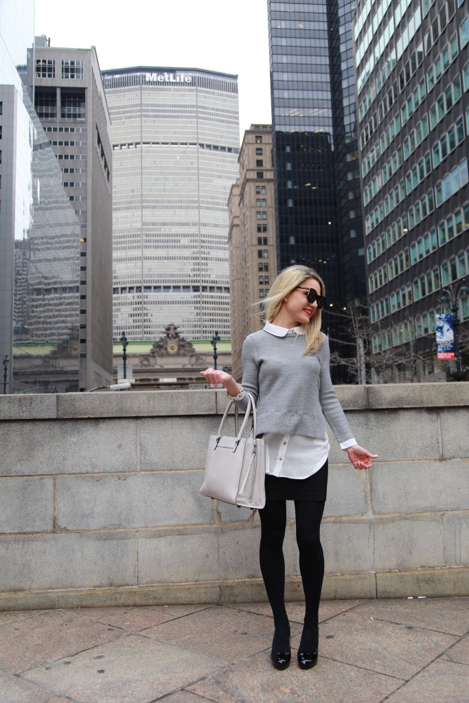 Caitlin Hartley of Styled American grey layered sweater, black skirt and tights