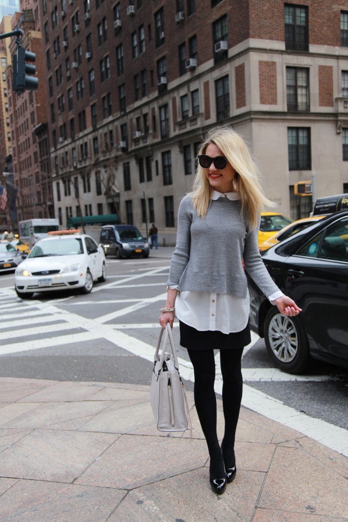 Caitlin Hartley of Styled American grey sweater, grey tote, black tights and black pumps