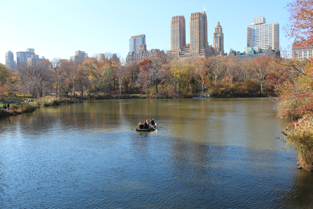 Caitlin Hartley of Styled American row boat in central park, view from bow bridge