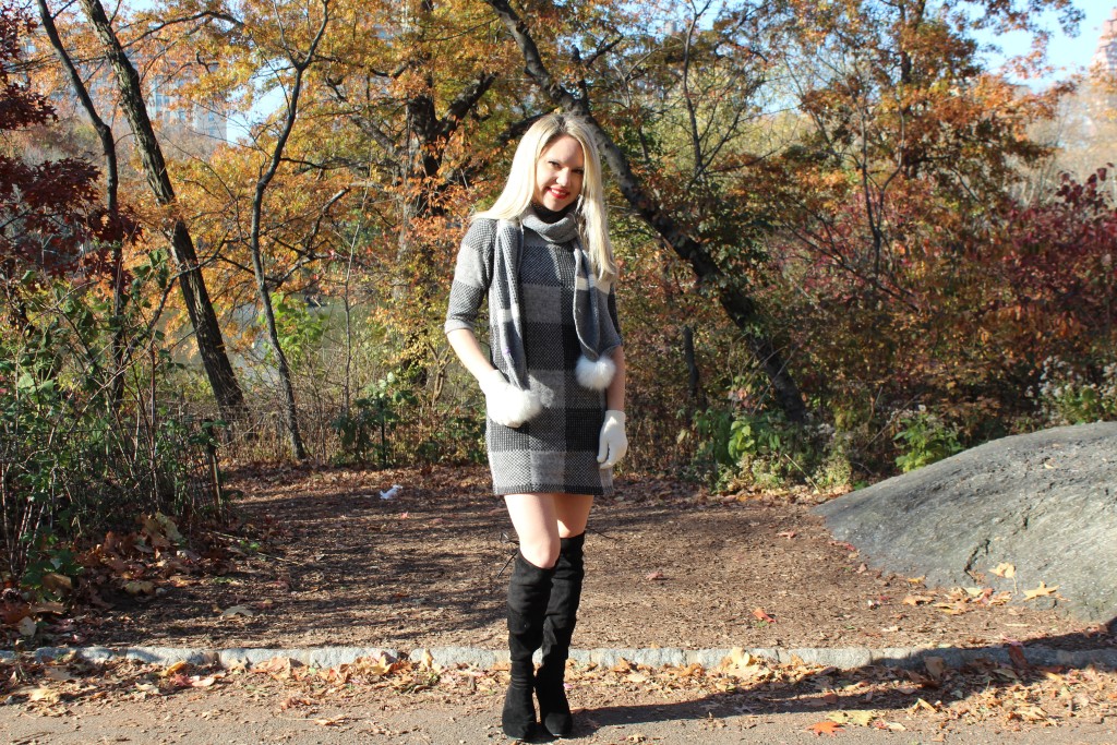 Caitlin Hartley of Styled American grey check dress, black boots and grey pom pom scarf