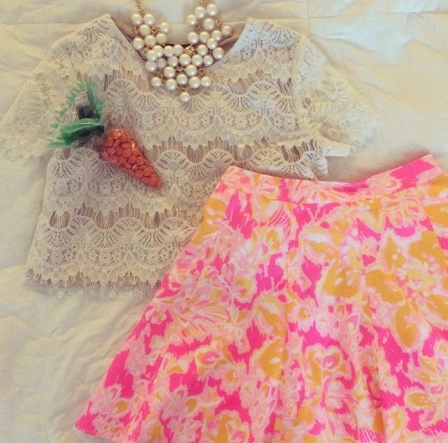 Caitlin Hartley of Styled American styled easter outfit with layered pearls, white lace crop top and pink floral skirt