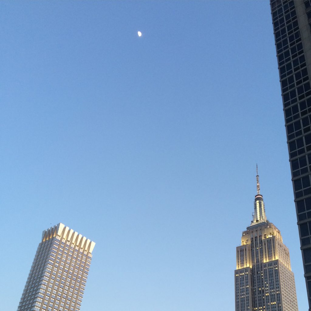 Caitlin Hartley of Styled American rooftop view of empire state building and the moon