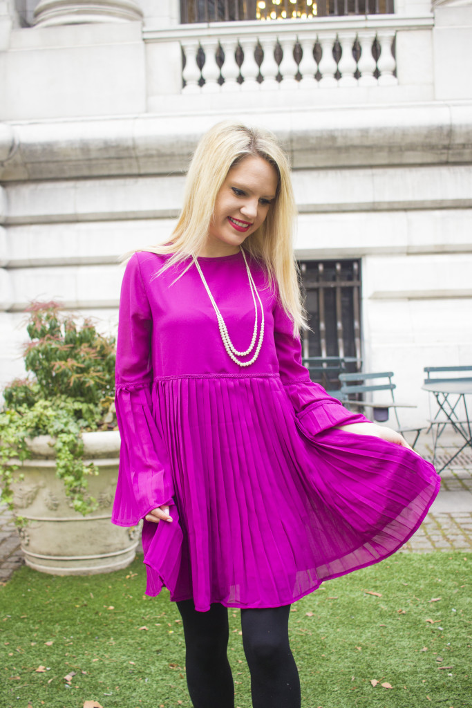 Caitlin Hartley of Styled American purple vintage pleated dress with pearls