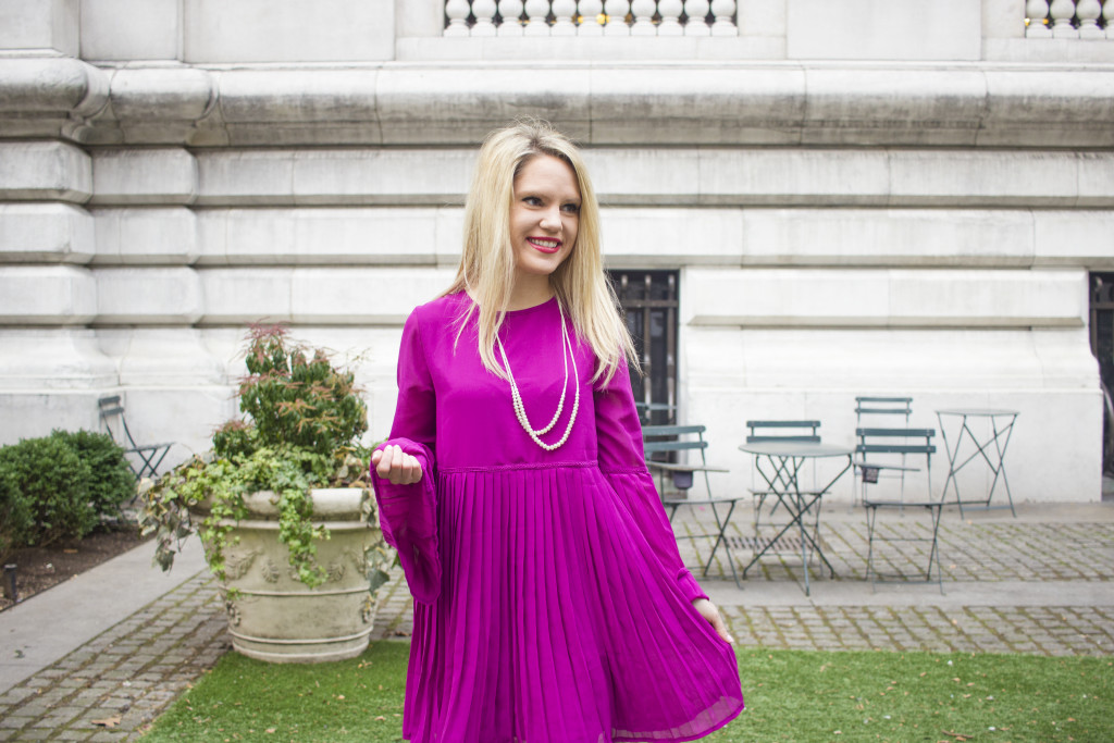 Caitlin Hartley of Styled American purple dress and layered pearls