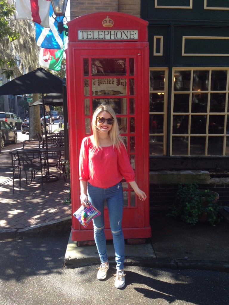 Caitlin Hartley of Styled American fashion blogger in front of London red telephone booth