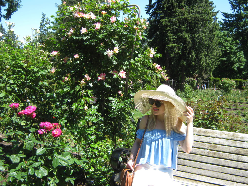 Caitlin-Hartley-of-Styled-American-rose-garden-floppy-sun-hat-sunglasses-off-the-shoulder-top-brown-bag