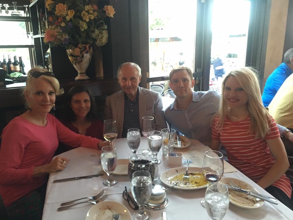 Caitlin-Hartley-of-Styled-American-in-striped-dress-at-dinner