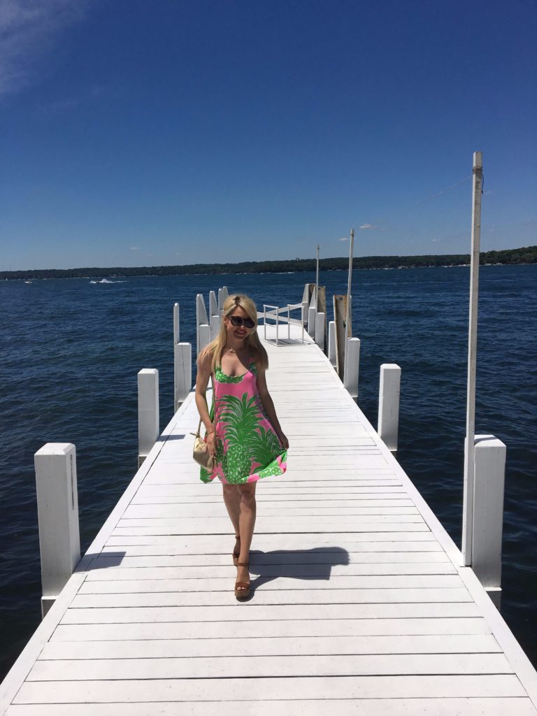 Caitlin-Hartley-of-Styled-American-in-pineapple-dress-on-a-dock