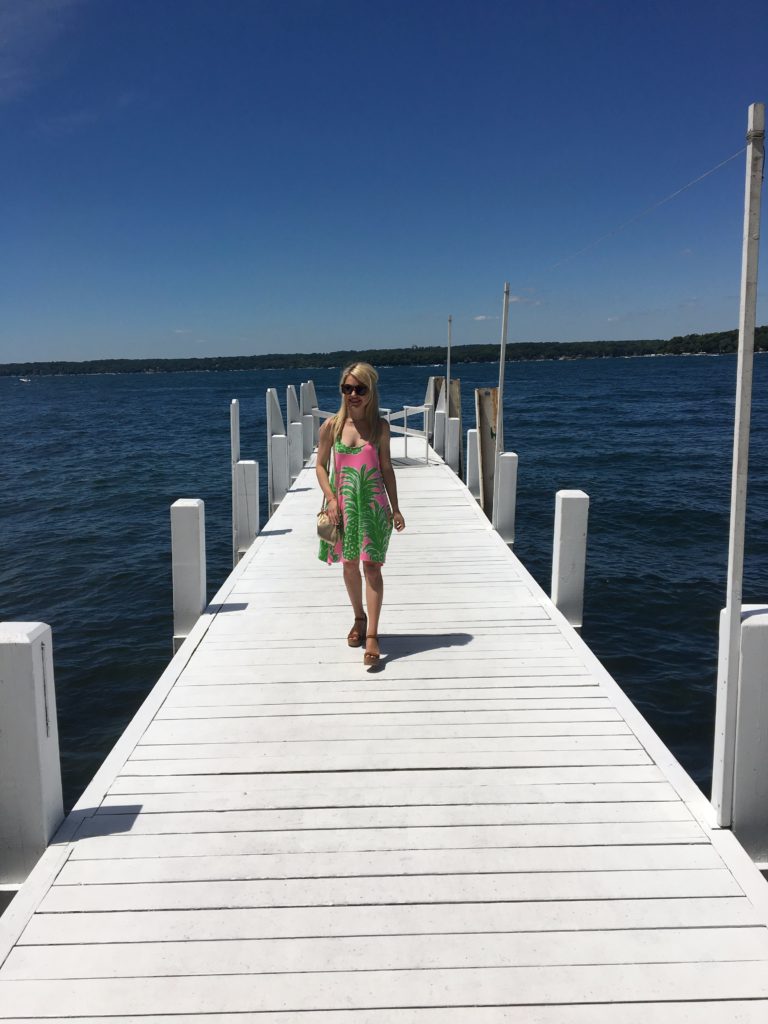 Caitlin-Hartley-of-Styled-American-walking-on-a-dock-in-lilly-pulitzer