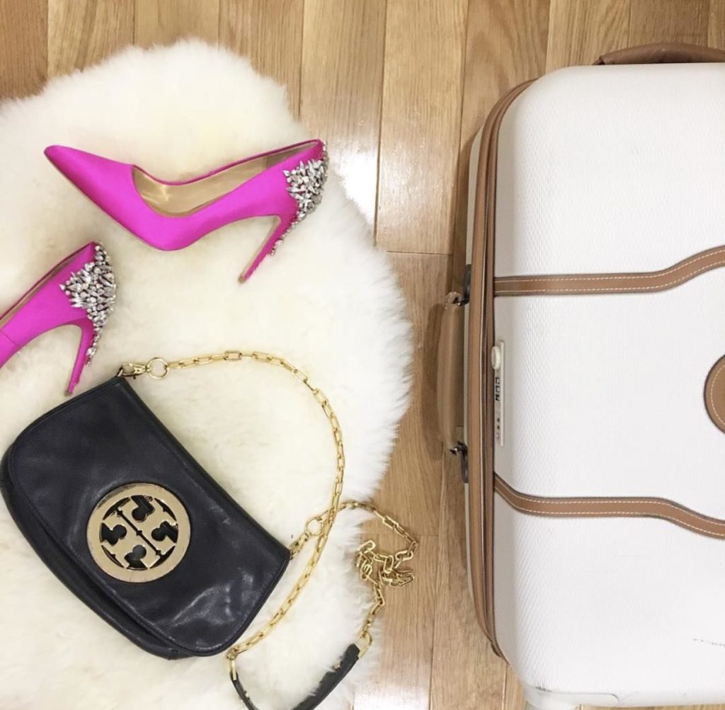 flatly of a suitcase and pink heels  http://styledamerican.com/instagram-roundup-summer-adventures/