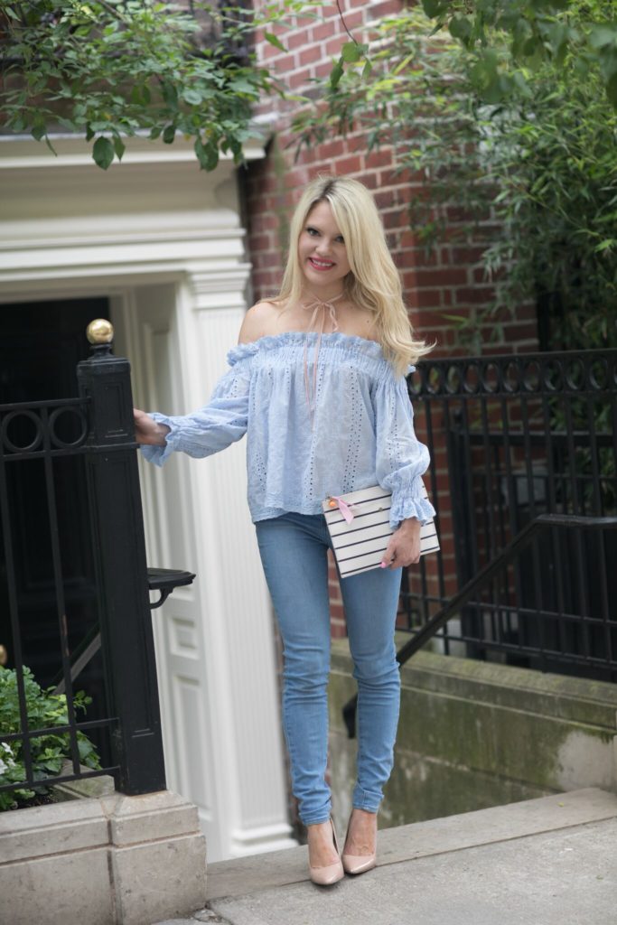 off shoulder top, striped clutch, denim jeans